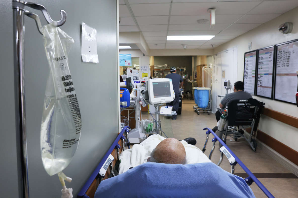 Patients rest in a hallway in the overloaded Emergency Room area at Providence St. Mary Medical Center on January 27, 2021, in Apple Valley, California.