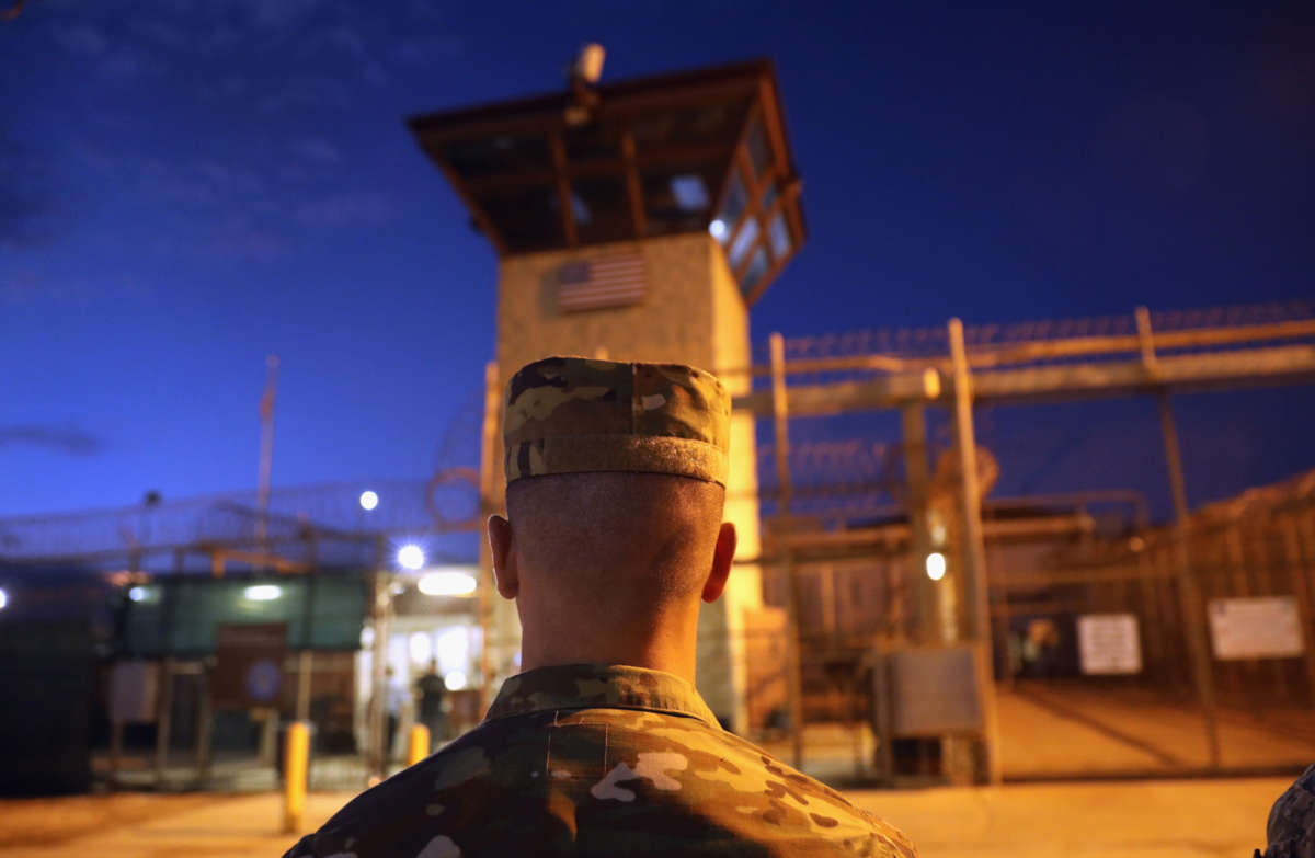 A U.S. Army soldier stands outside the entrance of the "Gitmo" detention center on October 22, 2016, at the U.S. Naval Station at Guantánamo Bay, Cuba.