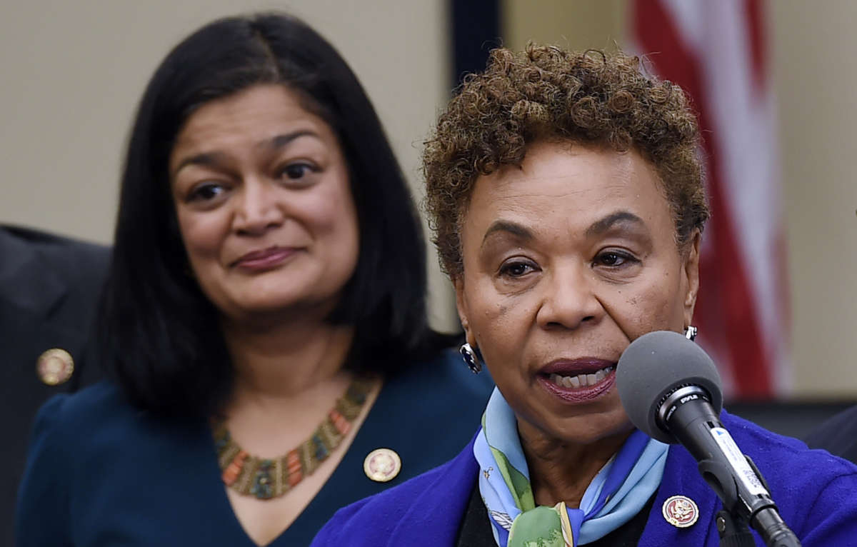 Rep. Barbara Lee speaks as Rep. Pramila Jayapal looks on during a news conference on Capitol Hill in Washington, D.C., on November 19, 2019.