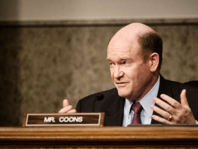 During a virtual event, Sen. Chris Coons invoked the January 6 insurrection to justify his opposition to temporarily suspending restrictive intellectual property protections.