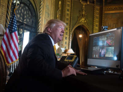 President Trump speaks to members of the U.S. military via video teleconference on Thanksgiving Day, November 23, 2017, from his residence in Mar-a-Lago in Florida.