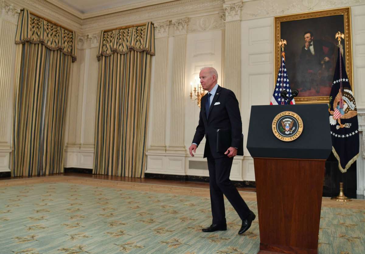 President Joseph Robinette Biden walks away from a podium