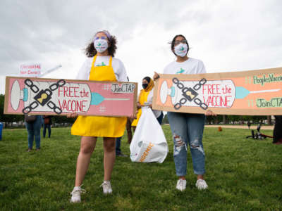 Demonstrators hold a rally to "Free the Vaccine," calling on the U.S. to commit to a global coronavirus vaccination plan that includes sharing vaccine formulas with the world to help ensure that every nation has access to a vaccine, on the National Mall in Washington, D.C., May 5, 2021.