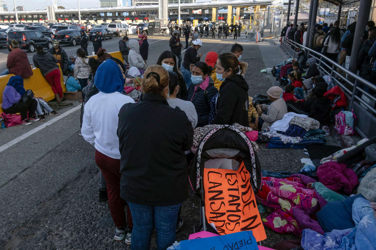 Migrants and asylum seekers are seen after spending the night in one of the car lanes off the San Ysidro Crossing Port on the Mexican side of the U.S./Mexico border in Tijuana, Baja California state, Mexico on April 24, 2021.
