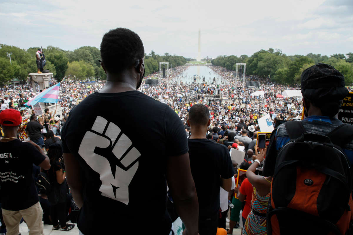 Thousands gather for the "Get Your Knee Off Our Necks" march on the anniversary of the 1963 Civil Rights March On Washington, at the Lincoln Memorial, in Washington, D.C., on August 28, 2020.