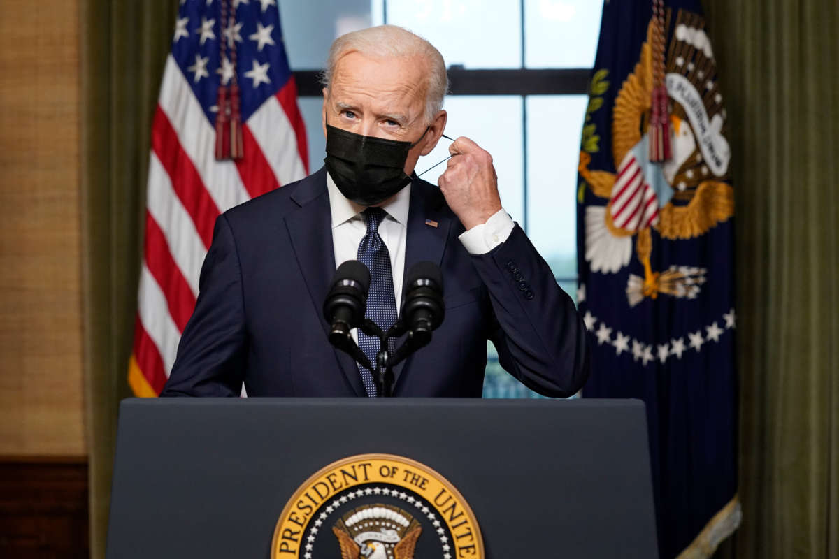 President Joseph Robinette Biden having a literal mask off moment