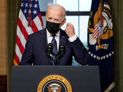 President Joseph Robinette Biden having a literal mask off moment