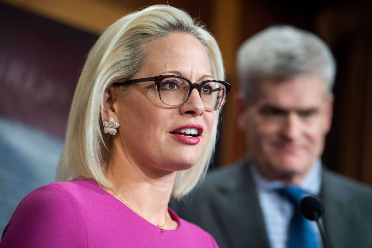 Sens. Kyrsten Sinema and Bill Cassidy conduct a news conference at the U.S. Capitol on December 4, 2019.