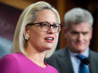 Sens. Kyrsten Sinema and Bill Cassidy conduct a news conference at the U.S. Capitol on December 4, 2019.