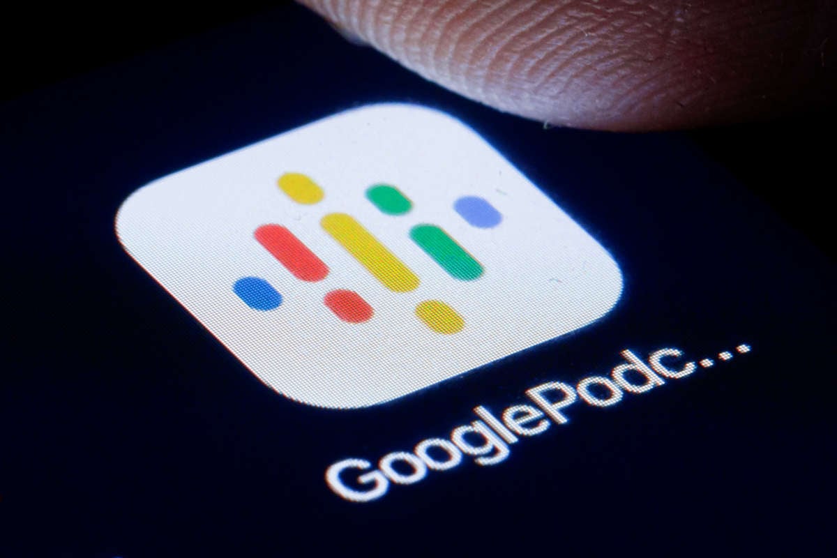 A closeup of a thumb about to press the "google podcast" icon on a smartphone screen