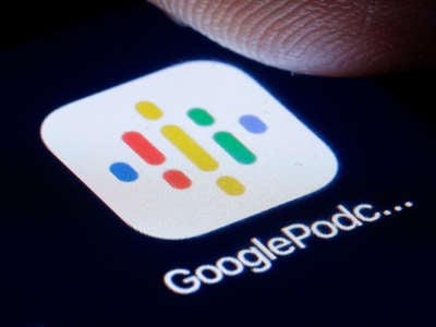A closeup of a thumb about to press the "google podcast" icon on a smartphone screen