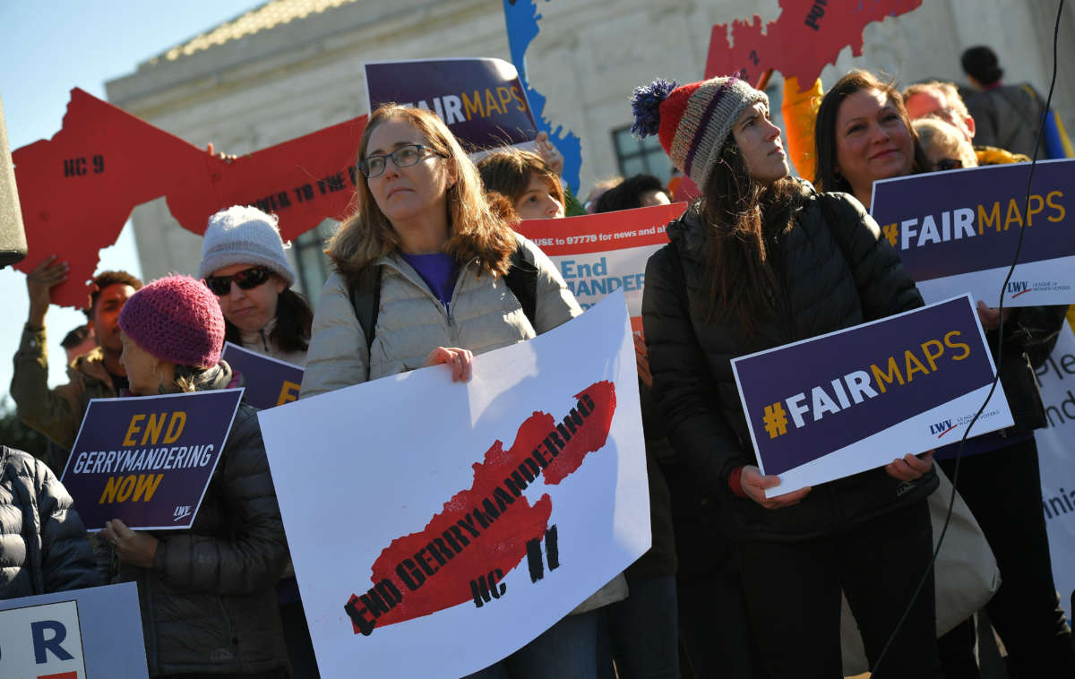 People gather during a rally to coincide with the Supreme Court hearings on the redistricting cases in Maryland and North Carolina, in front of the U.S. Supreme Court in Washington, D.C., on March 26, 2019.