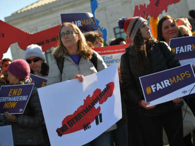 People gather during a rally to coincide with the Supreme Court hearings on the redistricting cases in Maryland and North Carolina, in front of the U.S. Supreme Court in Washington, D.C., on March 26, 2019.