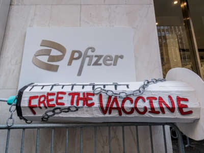 A syringe prop seen displayed at the protest on March 11, 2021, outside Pfizer Worldwide Headquarters in Manhattan.