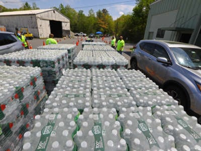 The city of Wayland, Massachusetts, distributes bottled water to the public due to elevated levels of PFAS found in its public water sources on May 16, 2021.