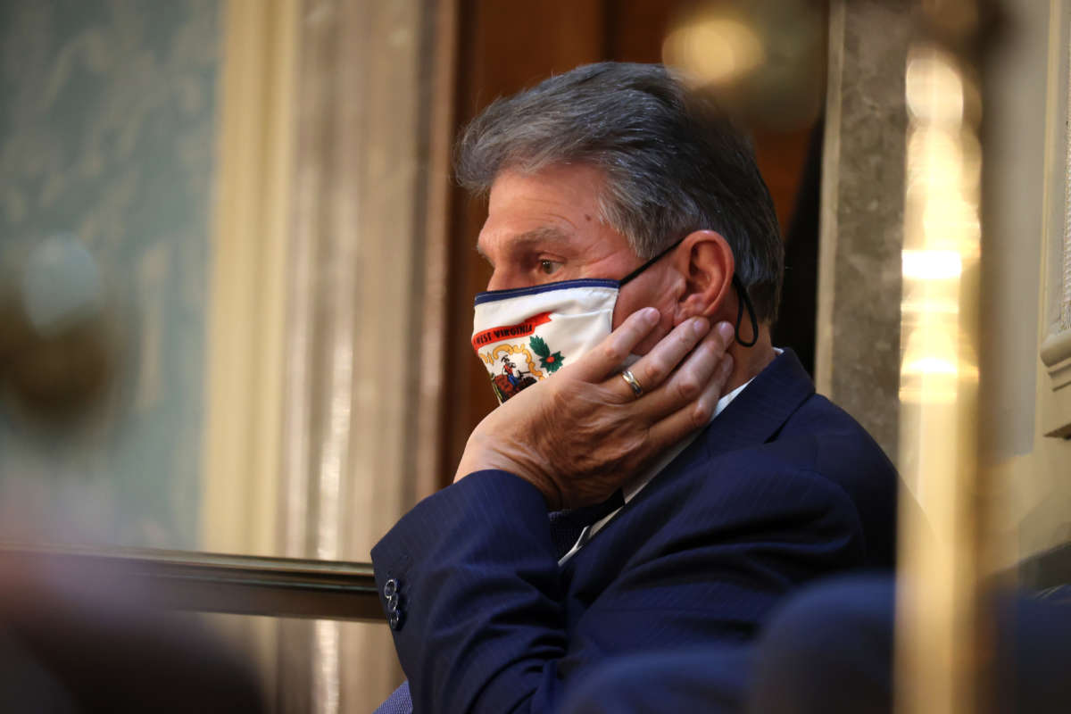 Sen. Joe Manchin looks on during U.S. President Joe Biden's address to a joint session of congress in the House chamber of the U.S. Capitol April 28, 2021, in Washington, D.C.