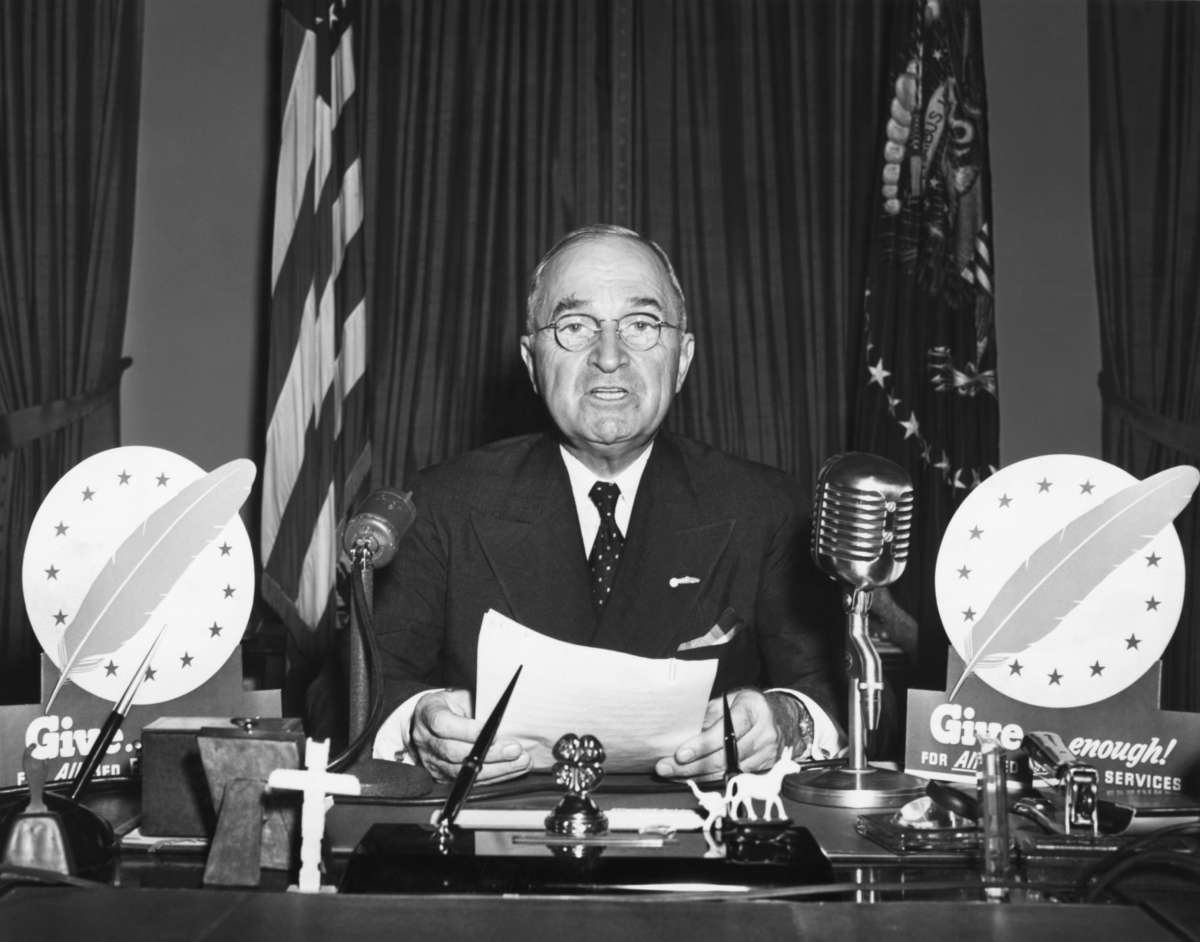 President Harry S. Truman speaks during a television address from the Oval Office.