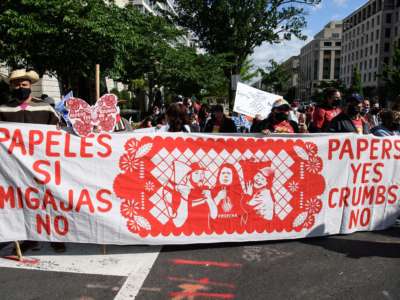 Activist from migrants organizations Cosecha (Harvest) and TPS Alliance protest near the White House on April 30 in Washington, DC, to demand more immigration action from the administration of US President Joe Biden.