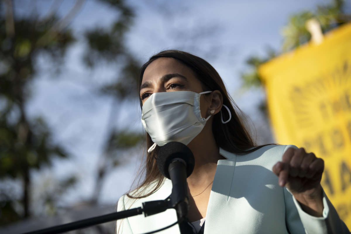 Rep. Alexandria Ocasio-Cortez (D-New York) speaks during a news conference to push then-President-elect Joe Biden to appoint a corporate-free cabinet outside of the Democratic National Headquarters in Washington on Thursday, Nov. 19, 2020.
