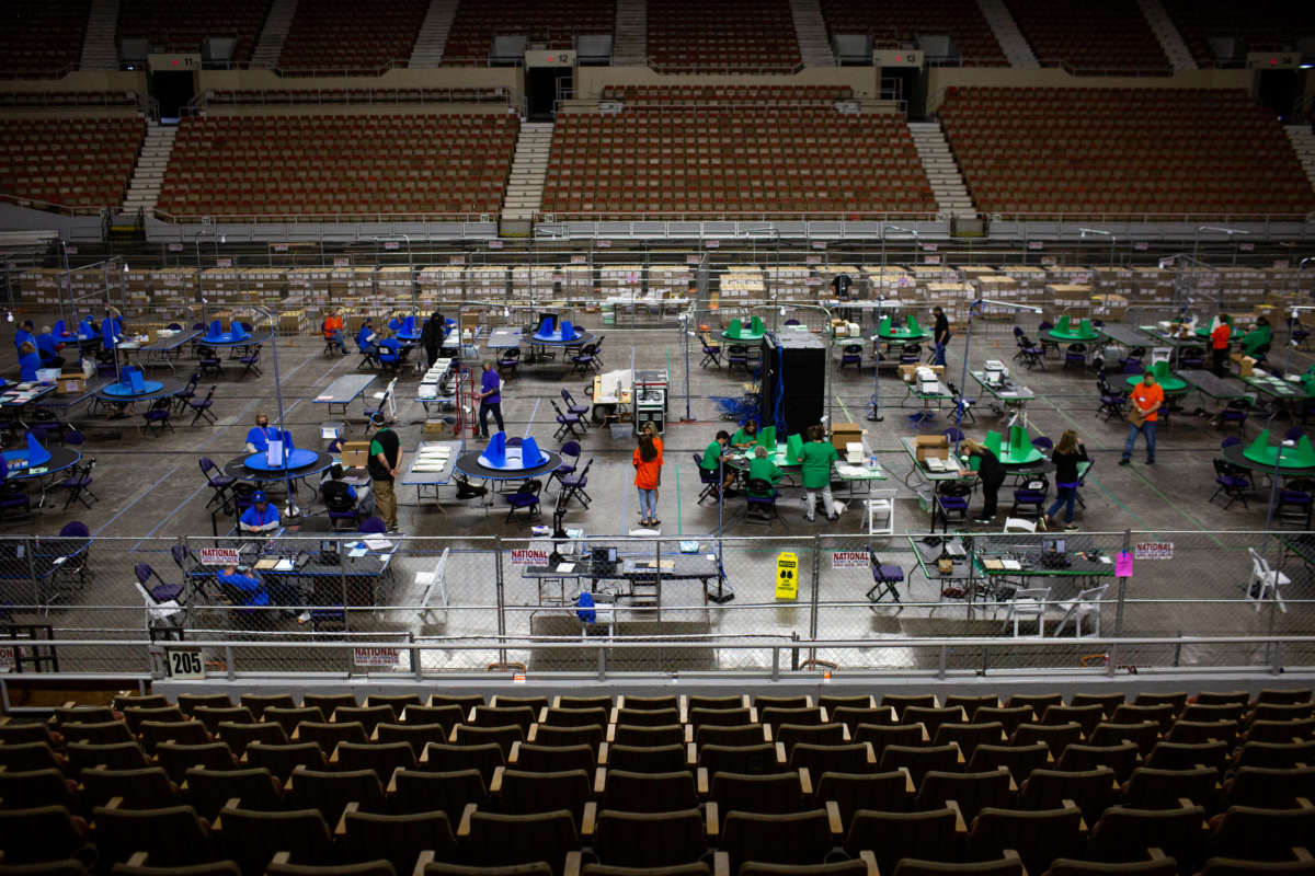 Contractors working for Cyber Ninjas, which was hired by the Arizona State Senate, review ballots from the 2020 general election on May 3, 2021 in Phoenix, Arizona.