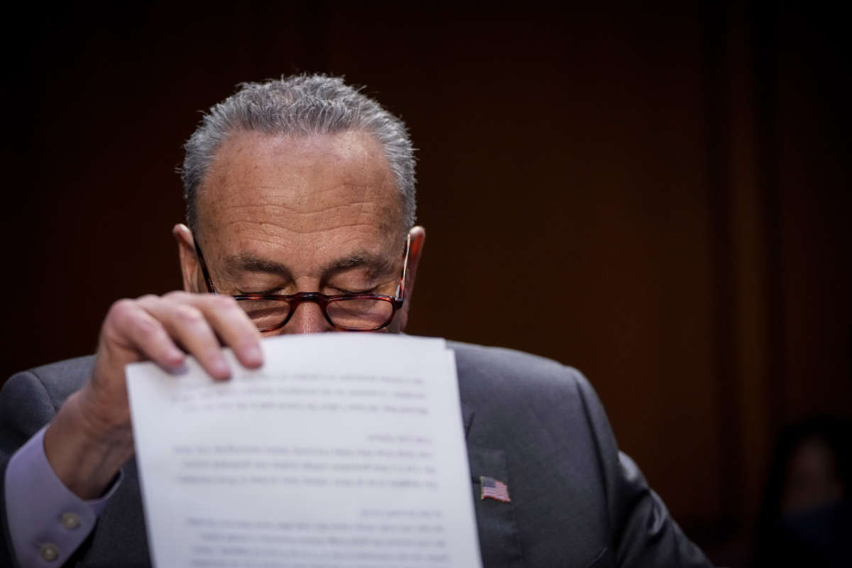Senate Majority Leader Chuck Schumer looks over notes during a Senate Judiciary Committee hearing on judicial nominations on June 9, 2021, in Washington, D.C.
