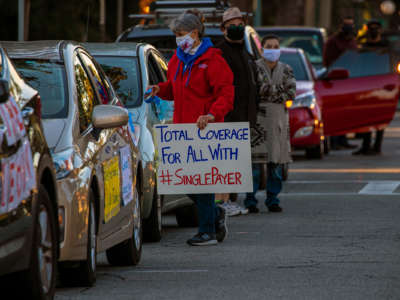 Americans for Democratic Action Southern California hold a car caravan and rally in memory of COVID-19 victims and call on California officials to switch the state to a "Medicare for All" health care system on January 1, 2021, in Pasadena, California.