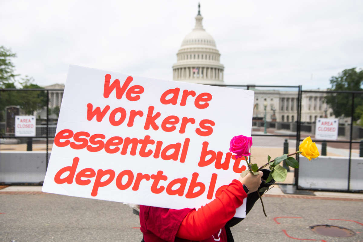An immigration activist is seen during a march to Constitution Avenue ahead of the Senate Judiciary subcommittee hearing titled The Essential Role of Immigrant Workers in America, on May 12, 2021, in Washington, D.C.