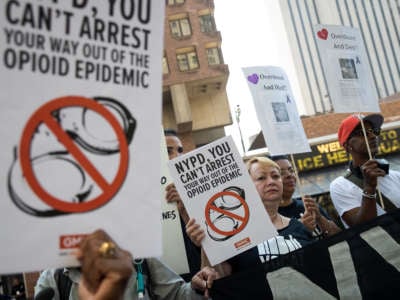 People protest the NYPD's handling of the opioid crisis