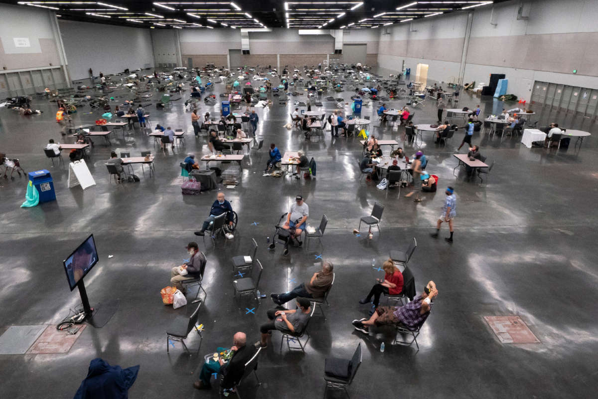 Portland residents fill a cooling center with a capacity of about 300 people at the Oregon Convention Center June 27, 2021, in Portland, Oregon.