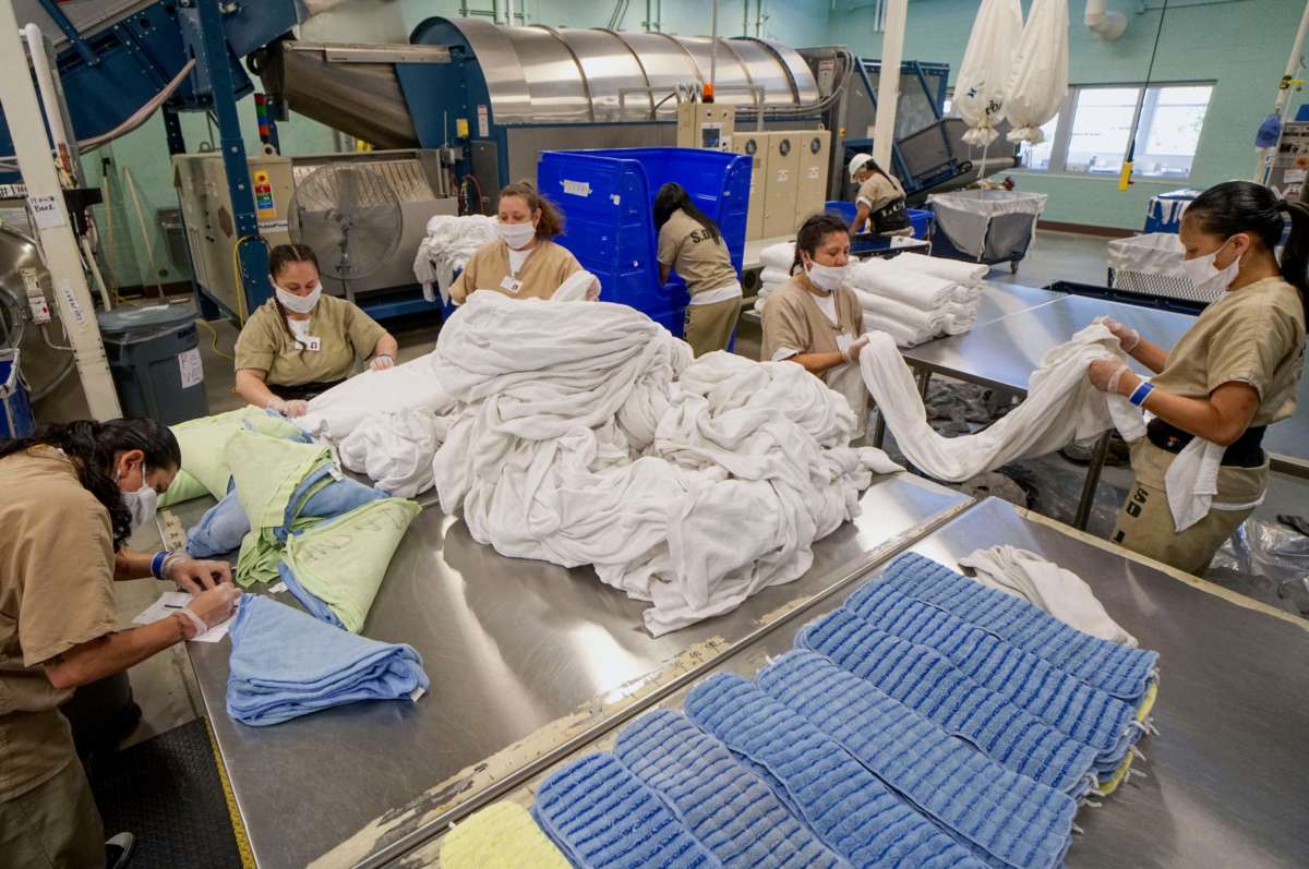 Prisoners work in the laundry room at Las Colinas Women's Detention Facility in Santee, California, on April 22, 2020.