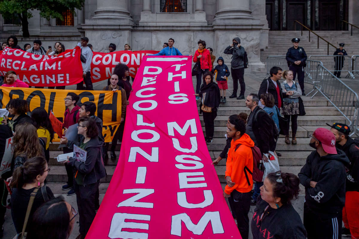 Activists lead an Anti-Columbus Day Tour at the American Museum of Natural History on October 8, 2018, in New York City.