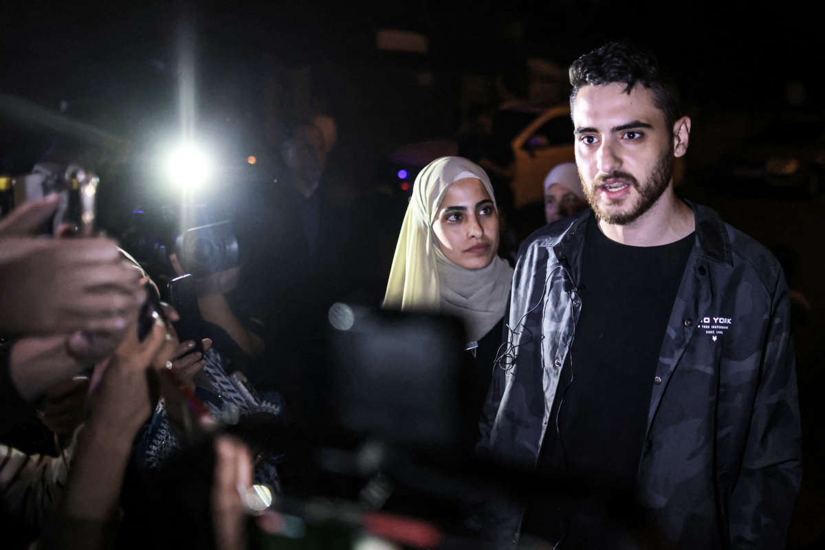 Palestinian activist twins Mona and Mohammad el-Kurd (right), speak to reporters after being released by Israeli authorities in the neighborhood of Sheikh Jarrah in East Jerusalem on June 6, 2021.