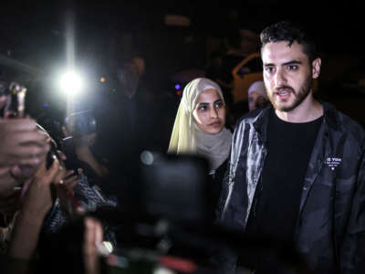 Palestinian activist twins Mona and Mohammad el-Kurd (right), speak to reporters after being released by Israeli authorities in the neighborhood of Sheikh Jarrah in East Jerusalem on June 6, 2021.