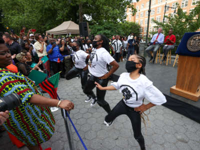 A new federal holiday, Juneteenth, is celebrated in the heart of Harlem in New York City on June 18, 2021. President Joe Biden signed legislation making June 19 a new national holiday.