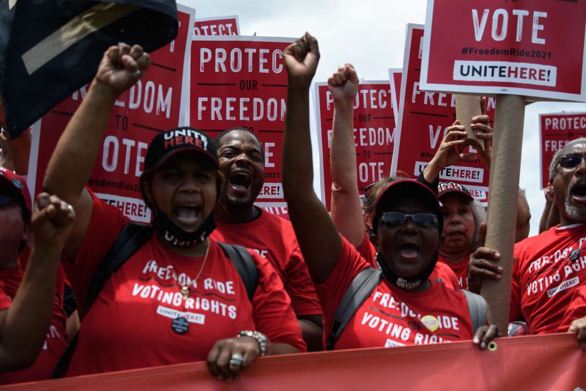 Supporters of the Freedom Ride for Voting Rights chant on the National Mall during a rally near the U.S. Capitol in Washington, D.C., on June 26, 2021.