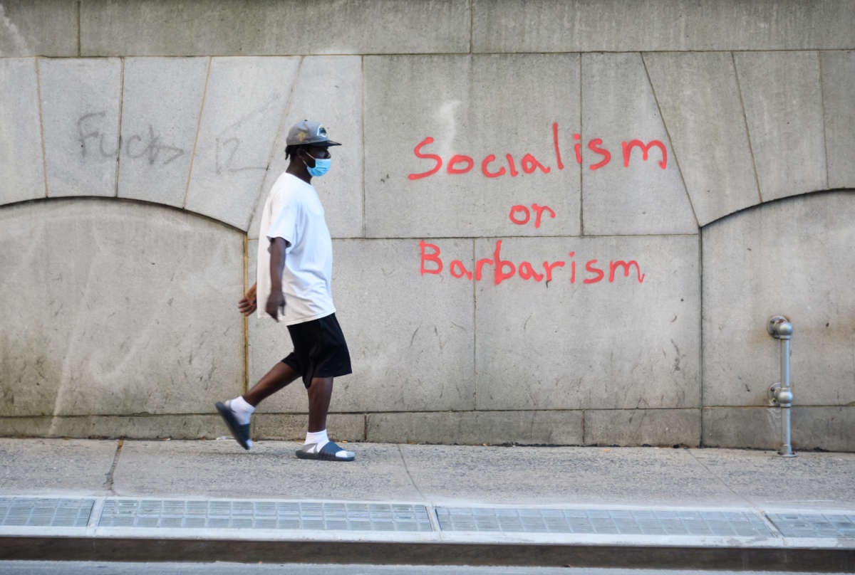 A person wears a protective face mask outside New York's City Hall on July 4, 2020.