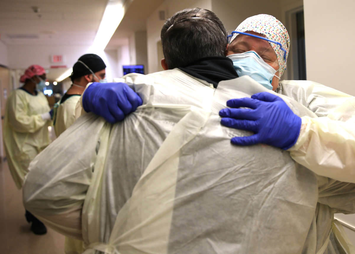 Chaplain Kevin Deegan hugs registered nurse Connie Carrillo (right) at Providence Holy Cross Medical Center in the Mission Hills neighborhood on February 17, 2021, in Los Angeles, California. The hospital is located in the northeast San Fernando Valley, which was a primary coronavirus hotspot in hard hit Los Angeles County. The patient population is predominantly from the Latinx community.