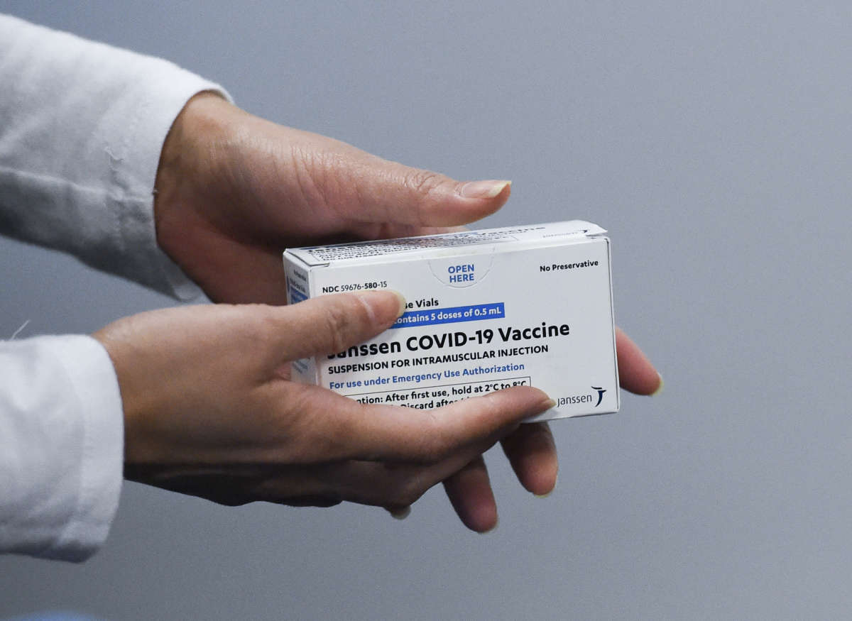 A health worker holds a box with the Janssen Johnson and Johnson COVID-19 vaccine at the Berks County Intermediate Unit in Muhlenberg township, Pennsylvania, on March 15, 2021.