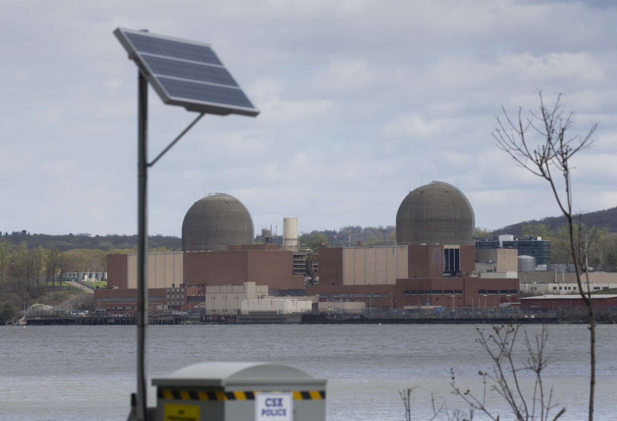 A solar panel is seen in front of the Indian Point Energy Center, a nuclear power plant, from Tomkins Cove, New York, on April 22, 2021.