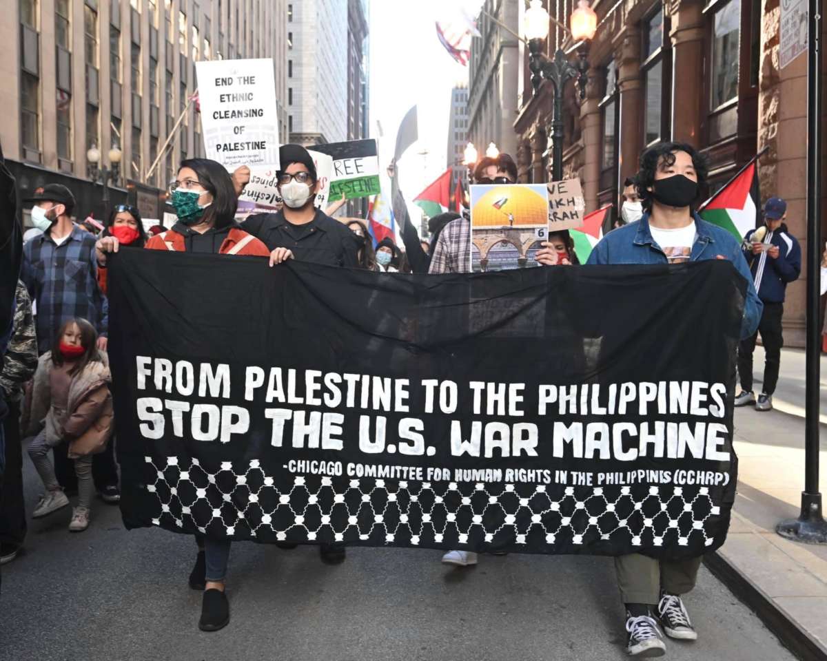 Activists from Filipino organizations march during a May 2021 Chicago rally in support of Palestine.