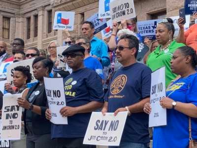 Progressive voting rights advocates and union members rally outside the Texas State Capitol on July 13, 2021, in support of more than 50 Democratic lawmakers who left the state in order to break quorum.