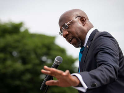 Sen. Raphael Warnock speaks at a rally outside the Supreme Court in Washington, D.C., on June 9, 2021.