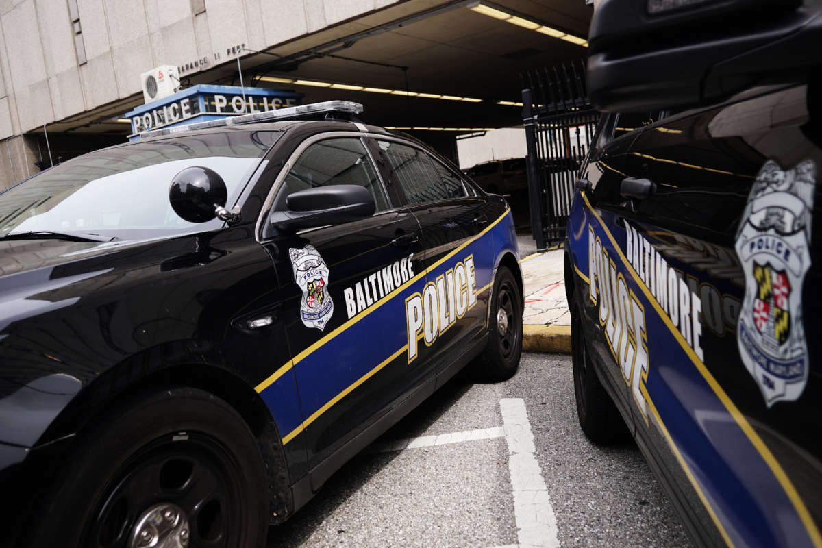 Police cars are seen outside of the Baltimore City Police Headquarters in Baltimore on August 8, 2017.