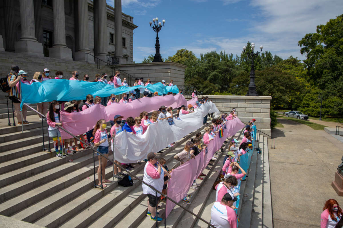 Members of the LGBTQ and allied community in South Carolina take part in a statehouse event during Trans & Queer Field Day on May 16, 2021.