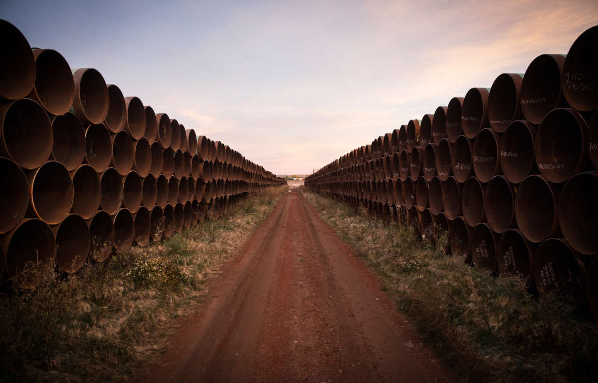 Miles of unused pipe, prepared for the proposed Keystone XL pipeline, sit in a lot on October 14, 2014, outside Gascoyne, North Dakota.