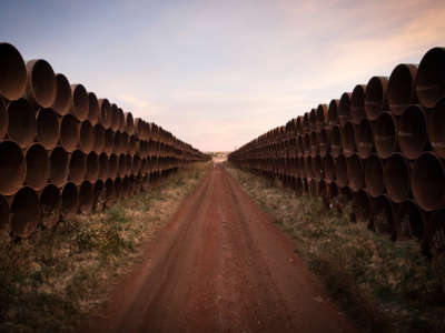 Miles of unused pipe, prepared for the proposed Keystone XL pipeline, sit in a lot on October 14, 2014, outside Gascoyne, North Dakota.