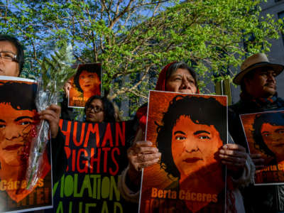 Environmental activists gather in front of the Office of American States in honor of prominent indigenous activist Berta Cáceres, on April 5, 2016, in Washington, D.C.