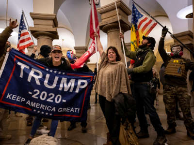 Trump supporters scream at the photographer in the U.S. Capitol