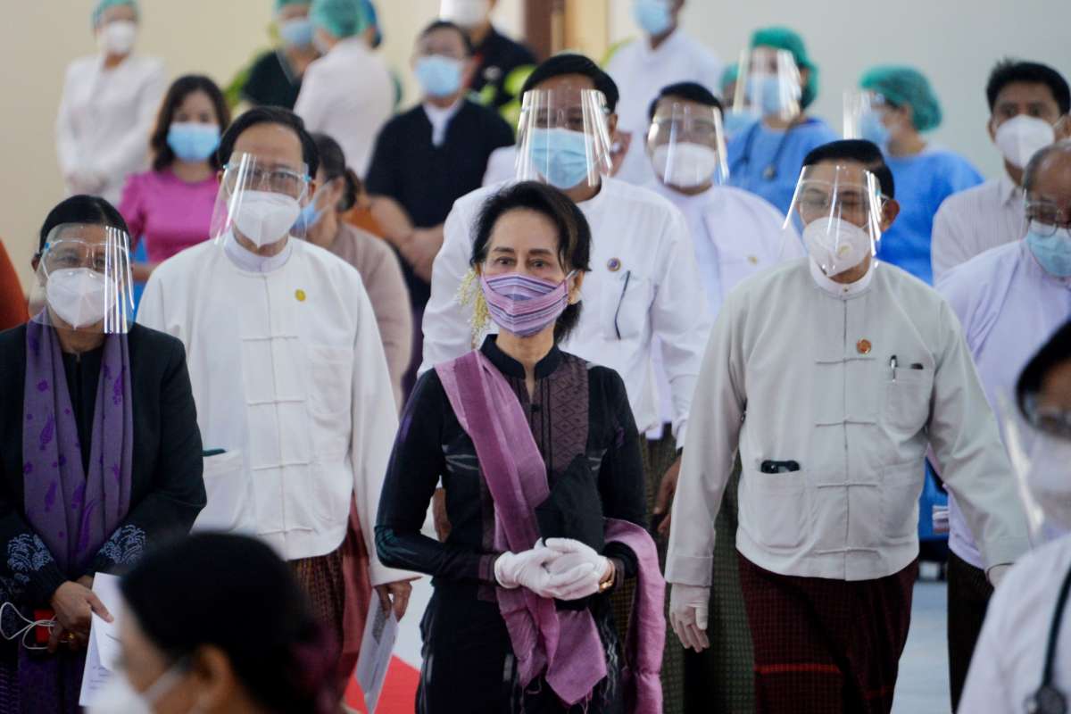Myanmar's State Counsellor Aung San Suu Kyi looks on as health workers receive a vaccine for the COVID-19 coronavirus at a hospital in Naypyidaw, Myanmar, on January 27, 2021.