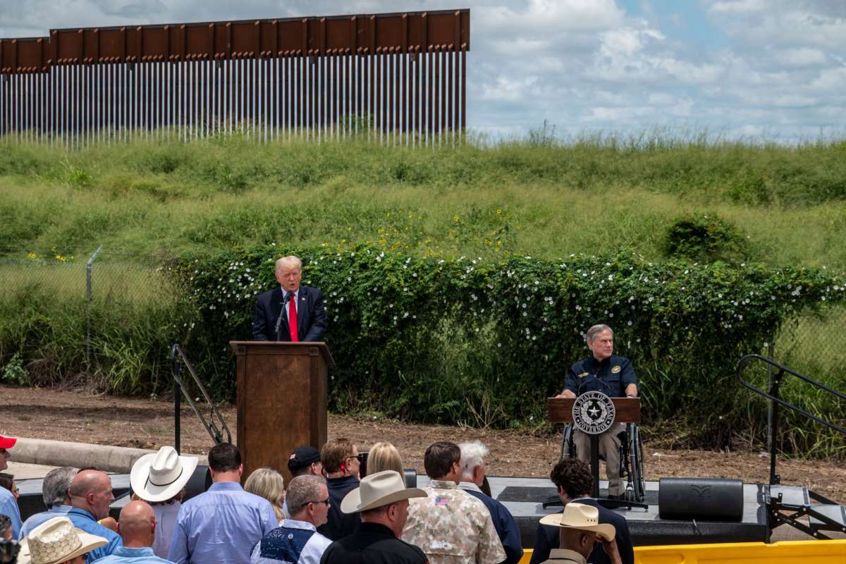 Former President Donald Trump speaks, flanked by Texas Gov. Greg Abbott, during a visit to the border wall near Pharr, Texas, on June 30, 2021.